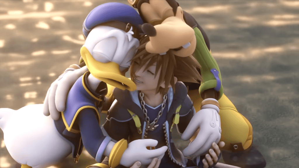 Sora, Donald and Goofy hugging at the end of Kingdom Hearts 2.